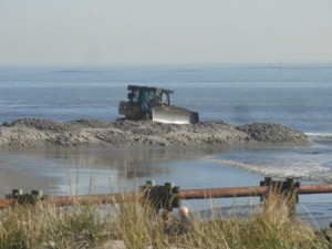 Bulldozers begin to shape the new beach at North Street in Ocean City on Tuesday morning.