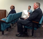 Charles E. "Chuck" Cusack, right, awaits sentencing Thursday afternoon in state Superior Court. At far left is his attorney, Louis M. Barbone. 