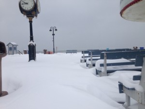 Wind-blown snow drifts deep in some spots and is blown clear in others early on Monday in Ocean City.