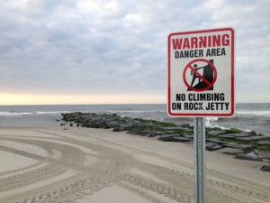 New permanent signs warn beachgoers to stay off the jetty at Ninth Street in Ocean City, NJ.