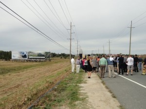 School and public officials gather for the unveiling of a new billboard on the 34th Street causeway near Ocean City, NJ.