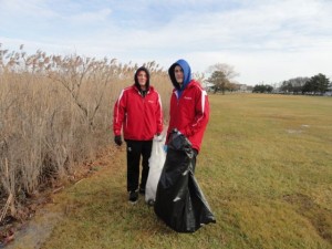 Tommy Cusack and Mike Kimball, junior members of Ocean City High School's South Jersey championship soccer team, fills bags with litter from the Ocean City Municipal Golf Course.