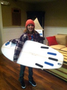 Luke Gallagher walks away with a prize board from Heritage Surf and Sport.