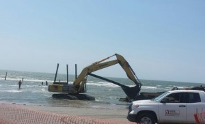 Work crews from Great Lakes Dredge and Dock Company remove the last vestiges of the 59th Street Pier on Tuesday, June 30, 2015.