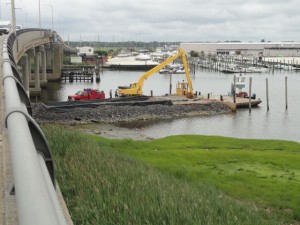 A landing area under the 34th Street Bridge will receive dredge materials from a barge and move them onto trucks bound for Wildwood.