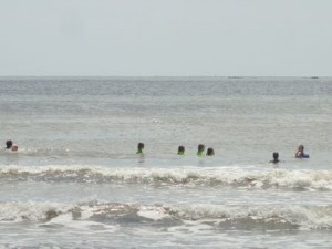 FCA surf campers take a plunge on Monday morning.