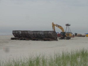 Work crews are consolidating equipment on the beach just north of the 52nd Street entrance on Tuesday (July 21).
