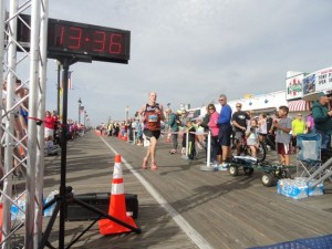 Stephen Hallman, 27, of Langhorne, Pa., wins the OCNJ Half Marathon with a cushion of more than four minutes over the next runner.