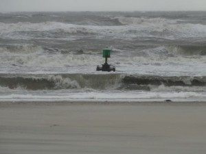 A navigational buoy washes up on the beach at 46th Street as a northeast swell continues to batter the beaches.