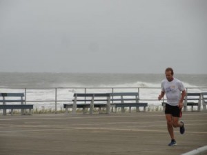 A boardwalk runner cuts into a brutal headwind on Sunday afternoon.