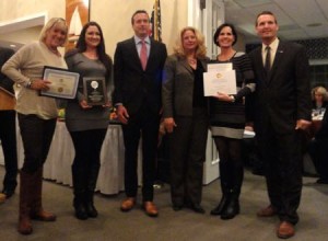 Employees Patty Fraser, Heather Murray (at left) and Mary Ann DiMarco (second from right) accept an Outstanding New Business Award for the Spotted Whale, a coastal living gift shop at 943 Asbury Avenue. They're pictured with Chamber President Bill McMahon, Cape May County Surrogate Sue Sheppard and Mayor Jay Gillian.