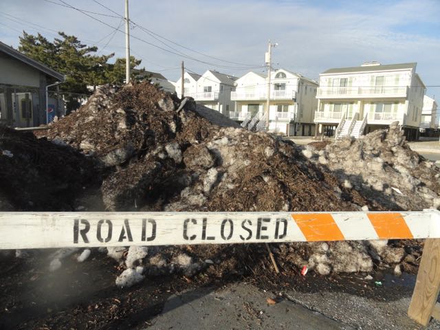 What turned out to be a blizzard elsewhere was mostly rain in Ocean City, but still piles of debris-filled snow remained at spots throughout town a week later.
