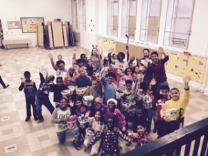 Students of the International Academy of Atlantic City Charter School, celebrate after receiving their special holiday treats