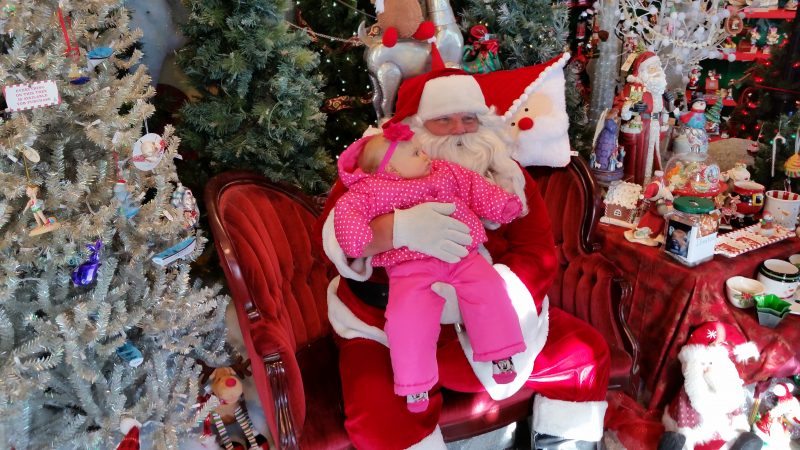 Santa shares a Christmas moment with 11-month-old Colette Thiel.