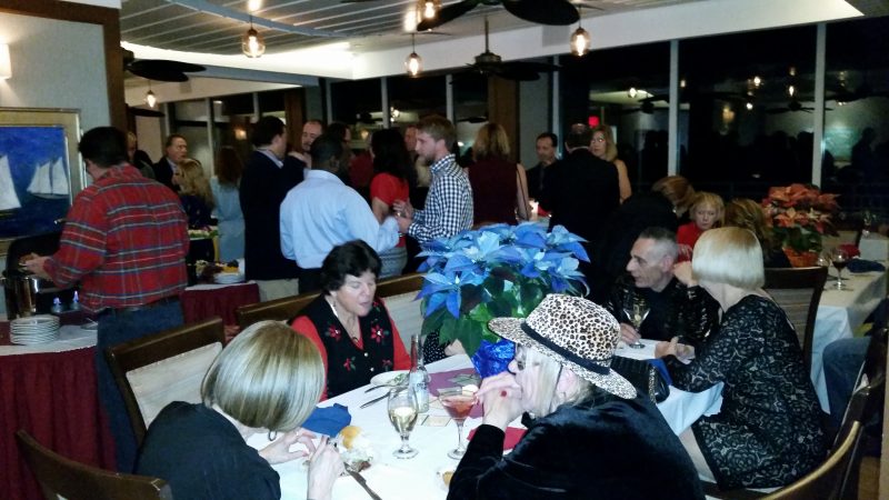 A record crowd of more than 150 people attended the holiday party and charity event at the Port-O-Call Hotel.