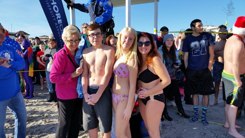 While some plungers were adorn in costumes, others braved the nippy surf in bathing suits.