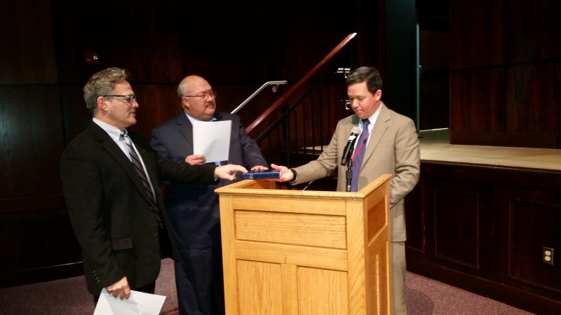 Board members Gregory Whelan, left, and Dale F. Braun Jr., center, were sworn in by Business Administrator Timothy Kelley.