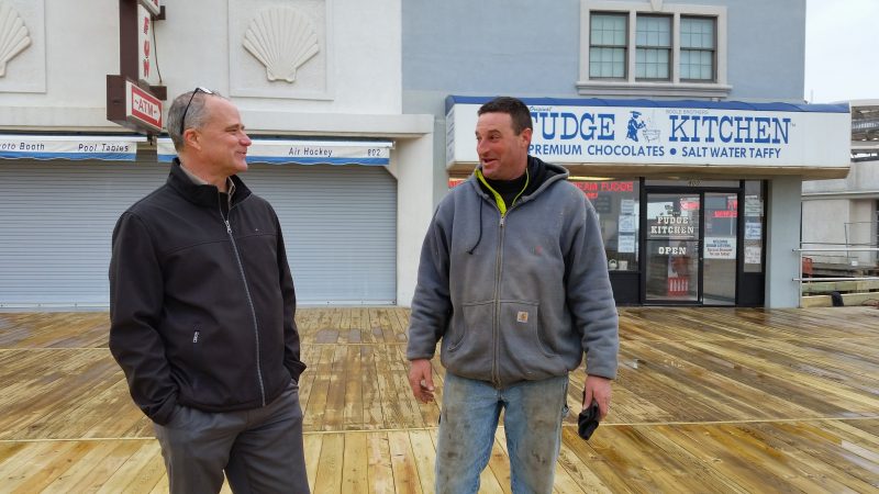 Doug Bergen, the city's public information officer, left, talks with Carlo DeFeo, a foreman on the project.