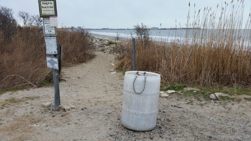 On Wednesday, a trash can was empty and the grounds appeared free of litter at the walkway to Dog Beach.