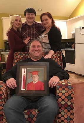 Holding Tyler's picture is his father Marte Onesty, standing behind him to the right is Tyler's mother Sally, to her left is their other son Zachary, and Amanda Stilts (Zach's girlfriend).